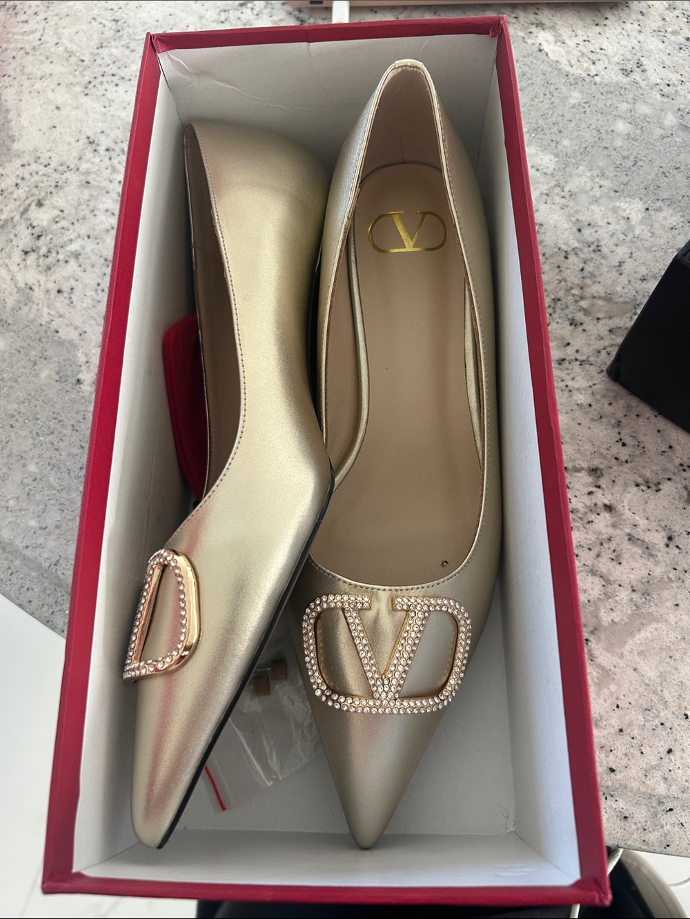 Inspired Gold Leather Pointed-Toe Flats with Embellished Logo Accent